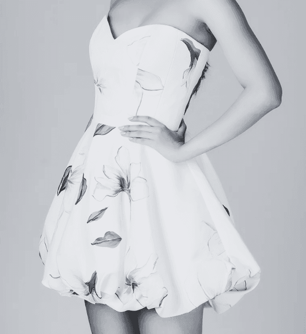 White mini dress with leaf print and fringe hem