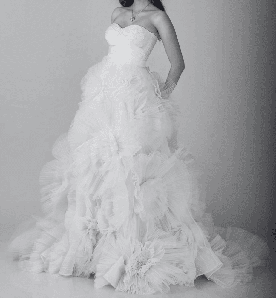 Back view of white satin mermaid gown with halter neck and lace train